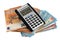 French purchasing power concept with a calculator lying on euro banknotes on a white background