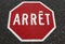 French Quebec stop sign painted on asphalt