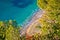 French riviera. Idyllic Cote d`Azur hidden beach in pine trees aerial view