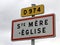 French road sign indicating the place where  the paratrooper hanging from the bell tower who fell during the Normandy landings