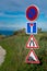 French road signs on a countryside dirt road