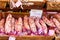 French saucissons and ham display in market in south of France