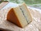 French semi-soft cow milk cheese morbier from Franche-Comte region with thin black layer and strong aroma