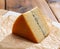 French semi-soft cow milk cheese morbier from Franche-Comte region with thin black layer and strong aroma