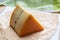 French semi-soft cow milk cheese morbier from Franche-Comte region with thin black layer and strong aroma