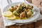 French shellfish bulot whelks served with a sauce of butter, gar