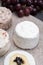 French soft cheeses, variety of different taste goat milk natural cheeses on granite plate close up sesrved as dessert