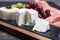 French soft cheeses, variety of different taste goat milk natural cheeses on granite plate close up sesrved as dessert