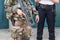 French soldier with an automatic riffle, policeman in the background, security and emergency state concept