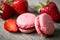 French speciality macaron and a strawberry