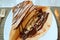 French Style Chocolate Banana Crape Served on White Plate