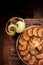 French sweet pie tart tatin apple cake upside down over on old rustic wooden background. Top view