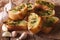 French toast with fresh herbs and garlic closeup, rustic