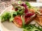 French Toast with Salmon Gravlax Sandwich served with Greens Salad.