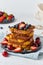 French toasts with berries, brioche breakfast, white background, vertical closeup