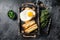 French toasts croque monsieur and croque madame with sliced ham, melted emmental cheese and egg. Black background. Top