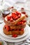 French toasts, French toasts made of sliced brioche with fresh strawberries and honey.