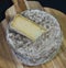 French tomme cheese for sale on a market stall