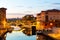 French town of Frejus overlooking embankment and marina at dusk