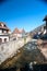 French traditional half-timbered houses and La Weiss river in Kayserberg