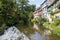 French traditional half-timbered houses near La Weiss river in Kayserberg village