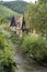 French traditional half-timbered houses near La Weiss river in Kayserberg village