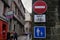 French traffic signs indicating a prohibited direction except for bicycles and a pedestrian street