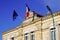 French tricolor and europa flag on mairie building mean city hall in town center in france