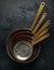 French Vintage Copper saute pans, kitchen utensil on dark background