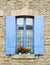 French window with blue shutters