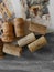 French wine corks on grey background close up