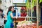 French woman choosing fruits on market