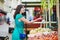 French woman choosing fruits on market