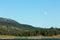 Frenchman lake at sunset land and water with full moon in the sky