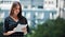 Fresh air brings fresh ideas. a young businesswoman using a tablet against an urban background.