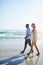 Fresh air does wonders for their relationship. a young couple taking a stroll along the beach.