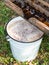 Fresh apple juice flows from press into bucket