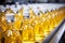 Fresh apple and pineapple juice being filled into glass bottles on the production line