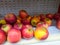 Fresh Apple placed in a white cooler shelf