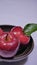 Fresh apple with stem leaf on bowl. Image fruit
