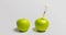 A fresh apple with a syringe and a decaying apple during, time laps, the concept of slowing down aging using medical and