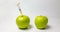 A fresh apple with a syringe and a decaying apple during, time laps, the concept of slowing down aging using medical and