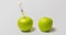 A fresh apple with a syringe and a decaying apple during, time laps, the concept of slowing down aging using medical and