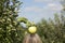 Fresh apple on top of blonde woman\'s head