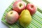 Fresh apples and pear tray background