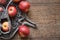 Fresh apples in a stretch bag on a wooden table, top view with copy space