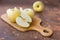 Fresh apples. Variety White pouring on a wooden cutting board