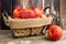 Fresh apples in vintage wire basket against rustic wood