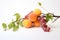 Fresh apricots and grapes on a white background. Isolated, Two peaches and grapes branch on white background, AI Generated