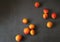 Fresh apricots, orange fruits, summer vitamins, small apricots on a dark background